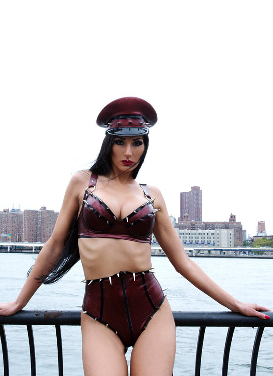 Woman in a latex outfit with a cityscape in the background