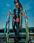 latex Biker sleeveless gilet jacket with fringing and a zip front worn with latex zip up stockings on a model.