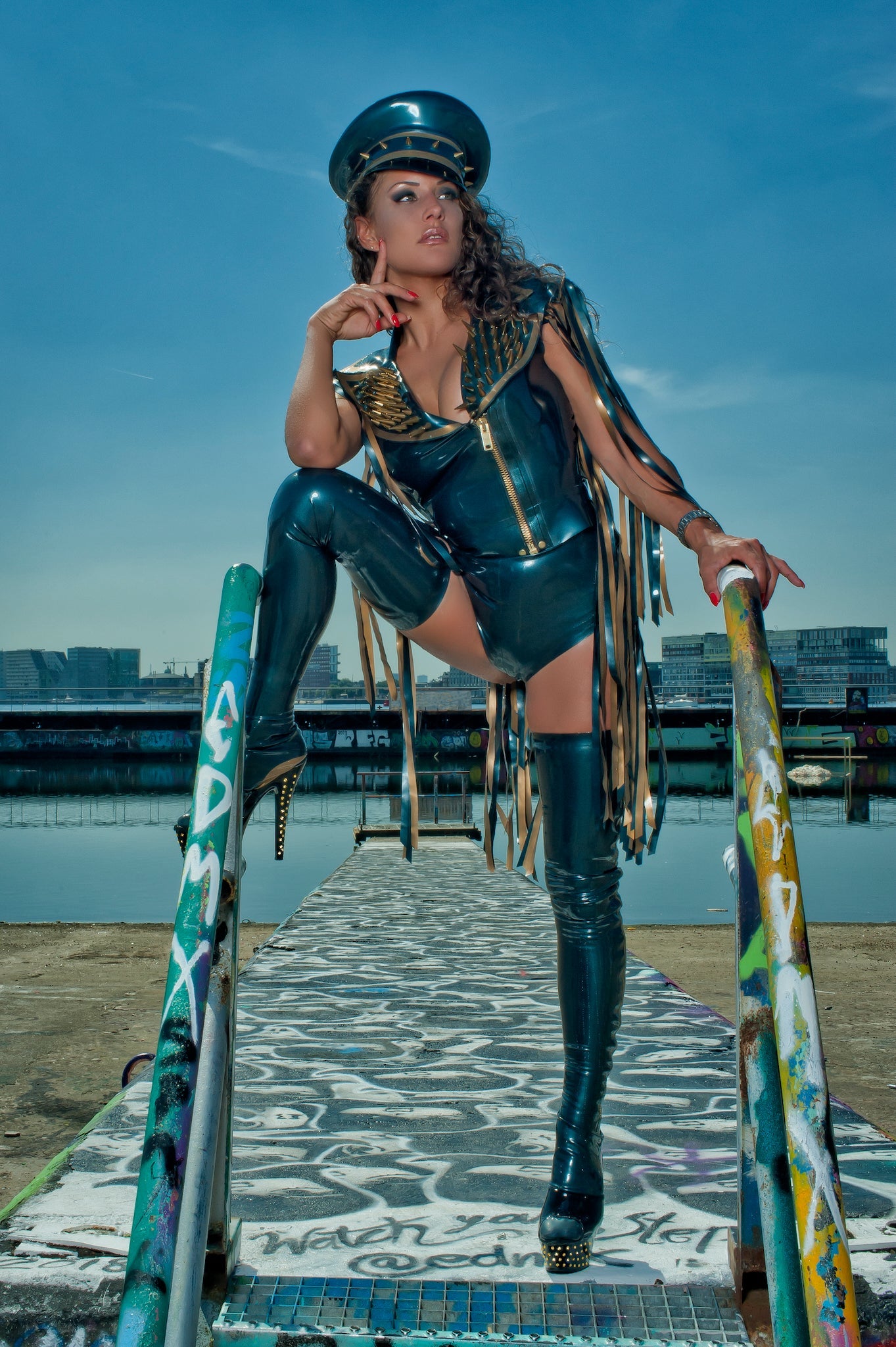 latex Biker sleeveless gilet jacket with fringing and a zip front on a model.