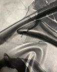 Close-up of a latex marble effect swatch in greys and blacks and silver
