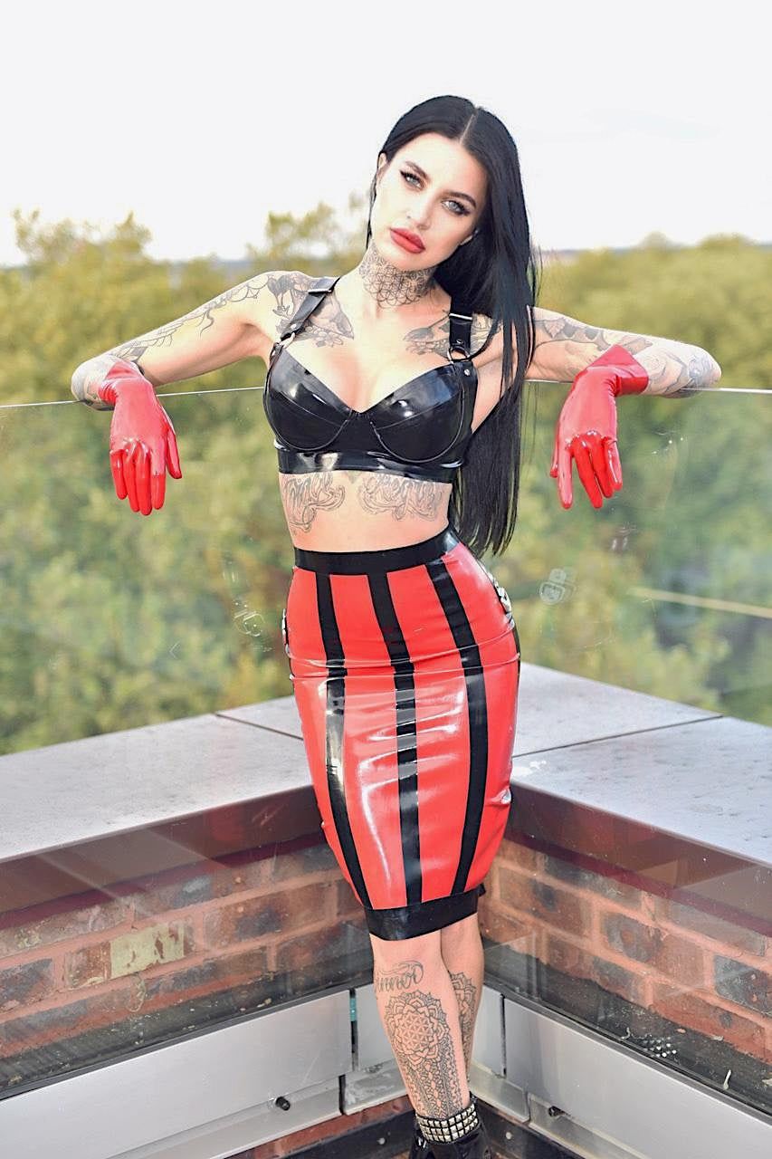 Latex skirt with special startburst design on back and stripes on the front. Contrasting colours red and black.