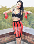 Latex skirt with special startburst design on back and stripes on the front. Contrasting colours red and black.