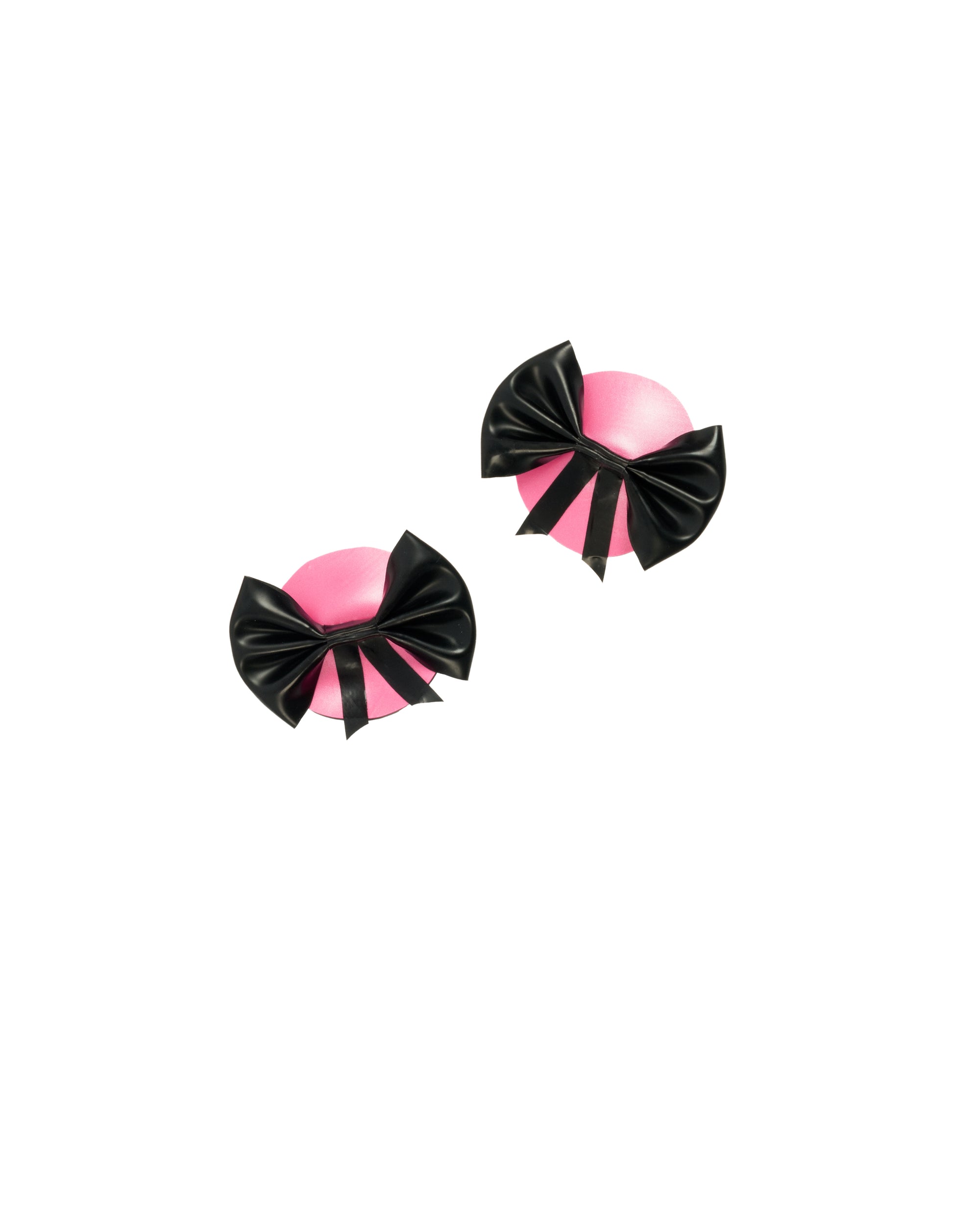 Pair of pink and black bow-shaped pasties on a white background